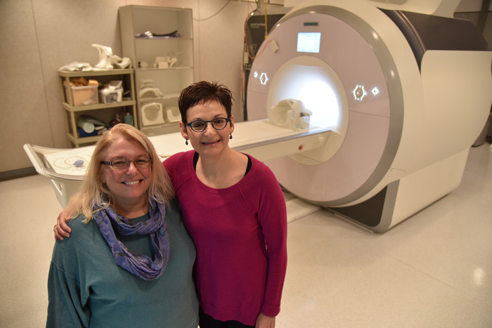 Deanna M. Barch, PhD (left), and Joan L. Luby, MD, analyzed brain scans from more than 100 children and found weaker connections involving key structures in the brains of poor children.