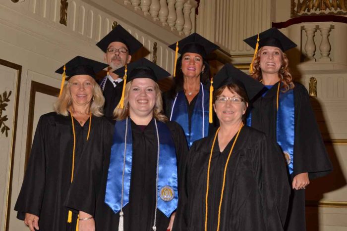 nurses who received bachelor's degrees pose for a photo