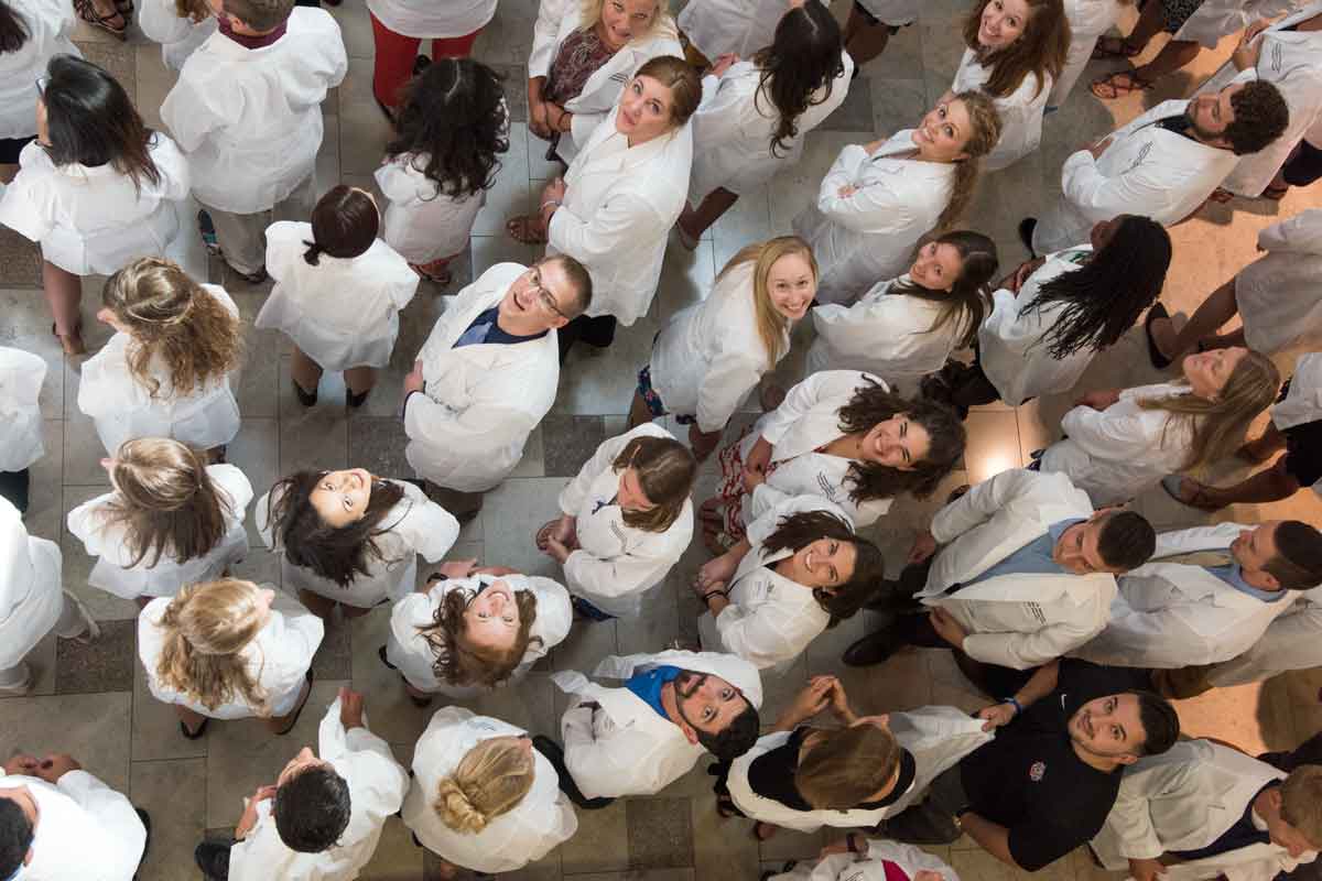 Students in the Program in Physical Therapy gather at the program's first-ever White Coat Ceremony.