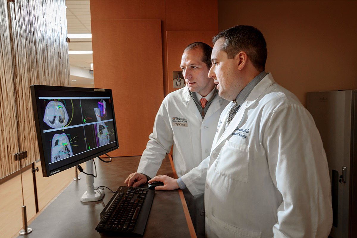 Radiation oncologist Clifford Robinson, MD, (right) and cardiologist Phillip Cuculich, MD, of Washington University School of Medicine in St. Louis, have developed a noninvasive radiation therapy approach to treating ventricular tachycardia, a deadly heart arrhythmia. Visual and electrical maps of the heart help direct a beam of radiation at the heart tissue triggering the heart to misfire, significantly reducing the arrhythmia. 
