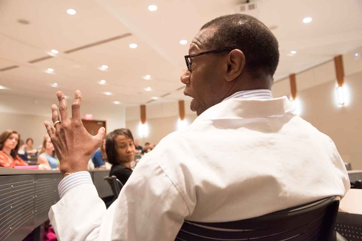 Will Ross, MD, the School of Medicine's associate dean of diversity, talks during an orientation session about challenges in caring for underprivileged patients.