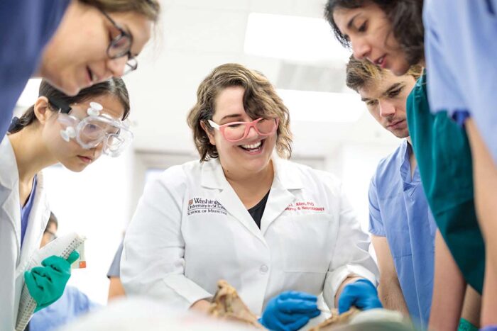 Assistant Professor Kari Allen, PhD, leads first-year students in their final day of dissection in anatomy class.