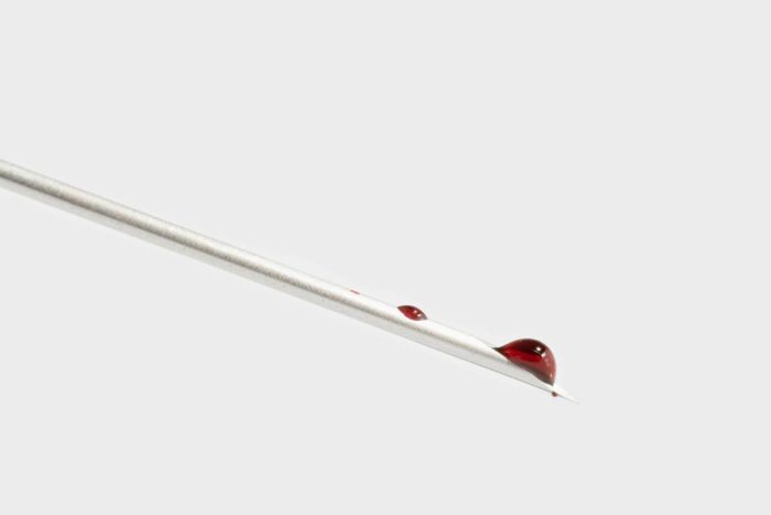 drop of blood on needle
