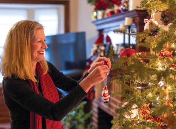 Patient Bridget O’Malley decorates for the holidays in her Central West End home after undergoing proactive surgery to reduce her cancer risk.