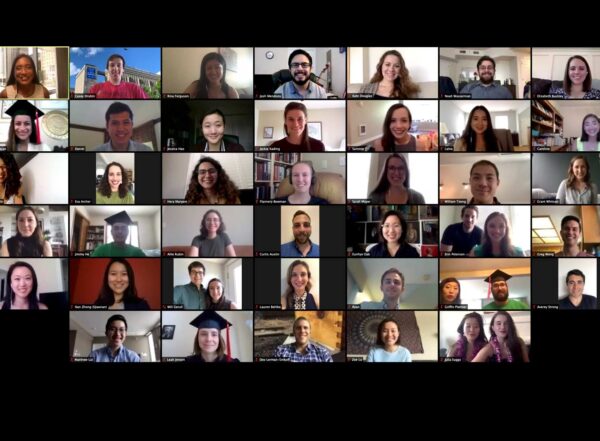 Screenshot of a Zoom call shows a grid of 32 smiling students ready to graduate