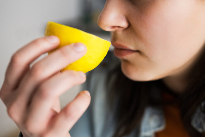 Woman Nose Sniffing Lemon
