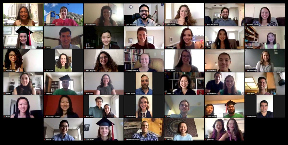 Screenshot of a Zoom call shows a grid of 32 smiling students ready to graduate