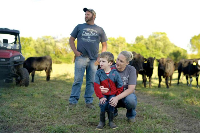 Jason and Amy Lair with their son, James, 8, on the family farm near Alexis, Ill. The Undiagnosed Diseases Network discovered a genetic variant that inhibits James’ growth.