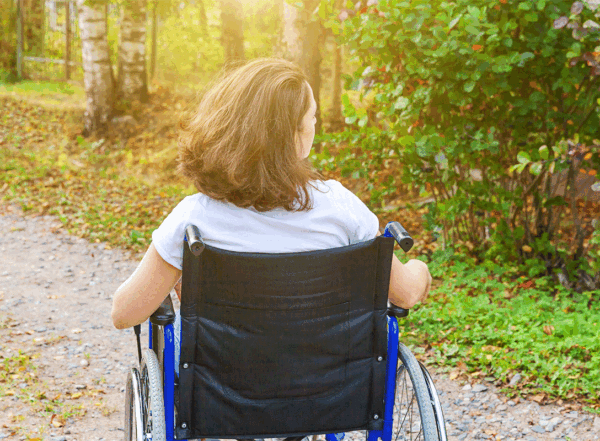 Woman in wheelchair outdoors